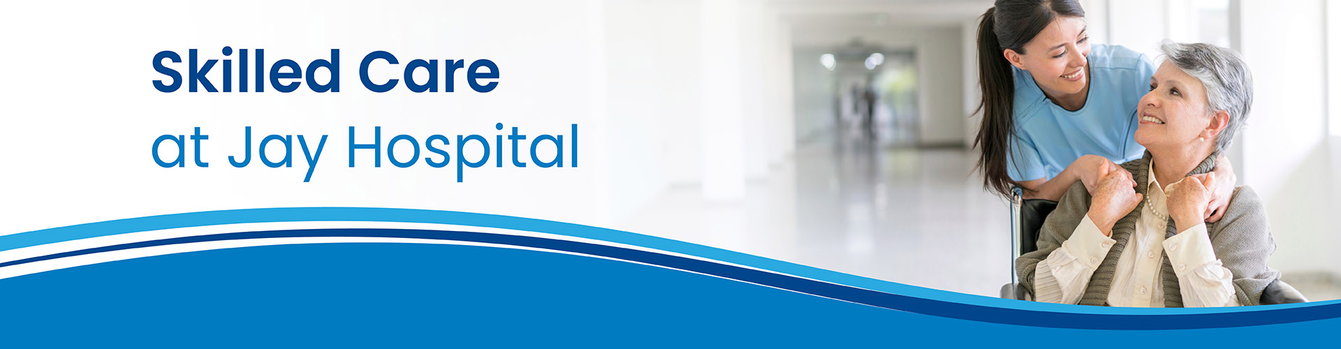 Woman talking to an older lady at a hospital